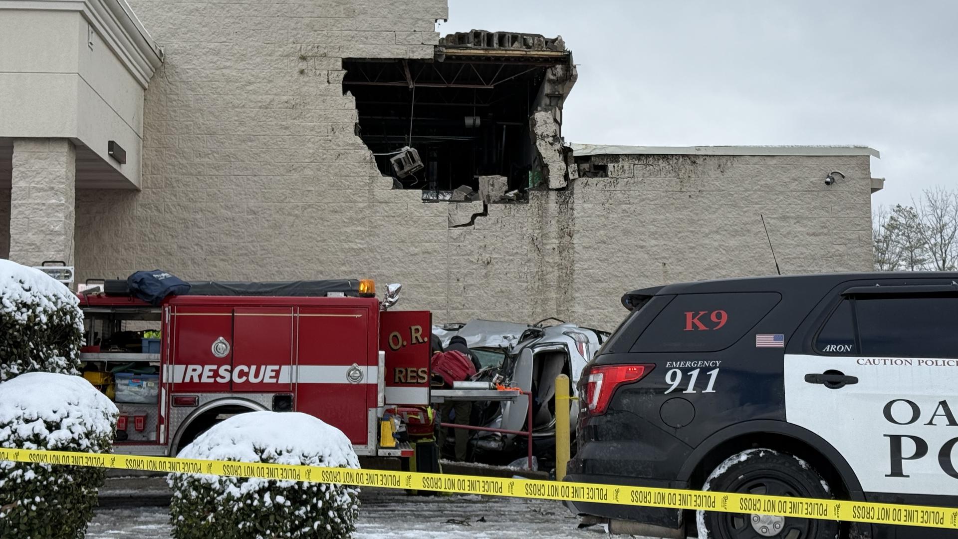 A large number of emergency crews responded Saturday after a car crashed into the side of a Food City.