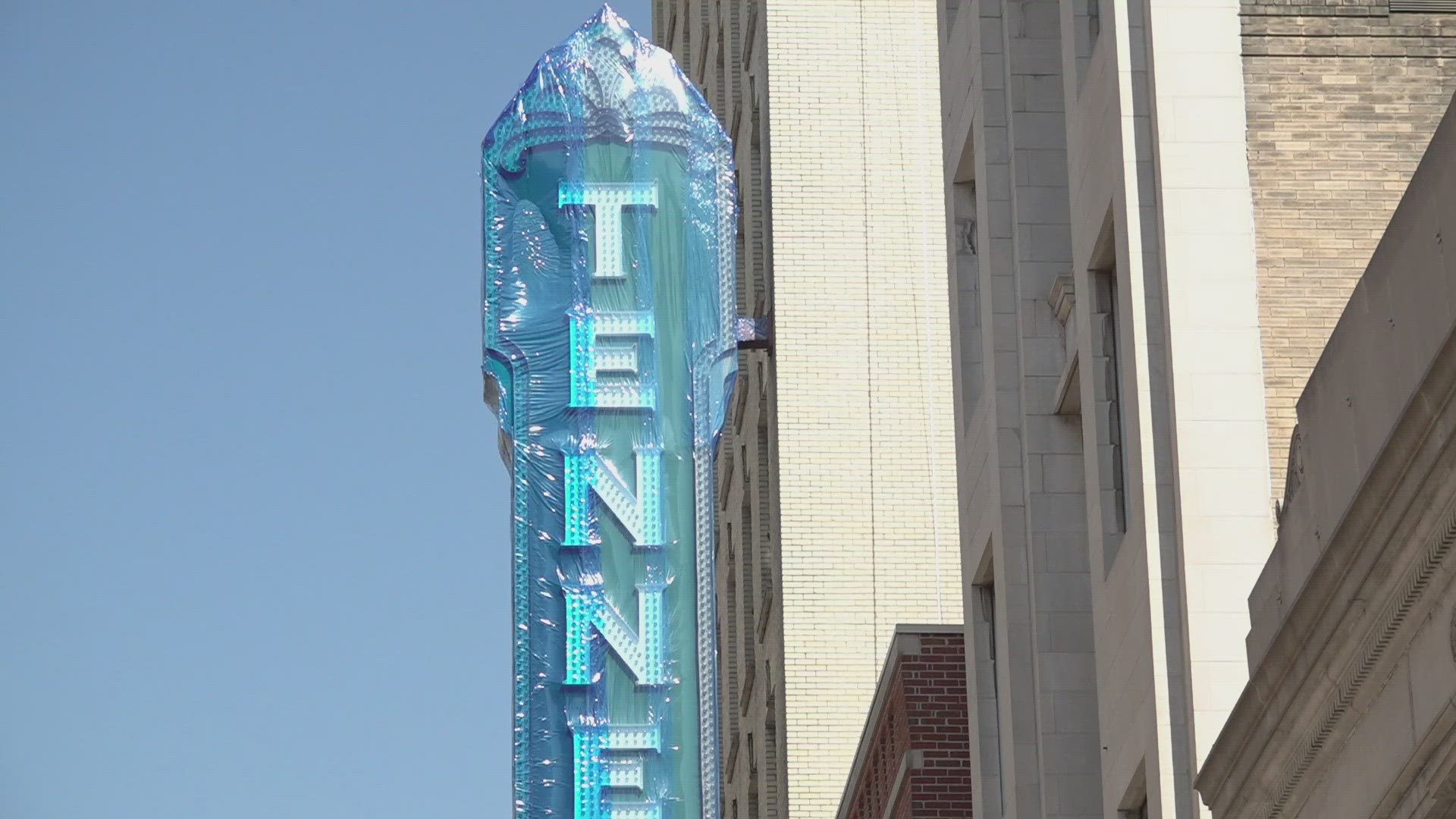 The roof on the Burwell Building is being fixed and workers are worried debris could damage the sign.