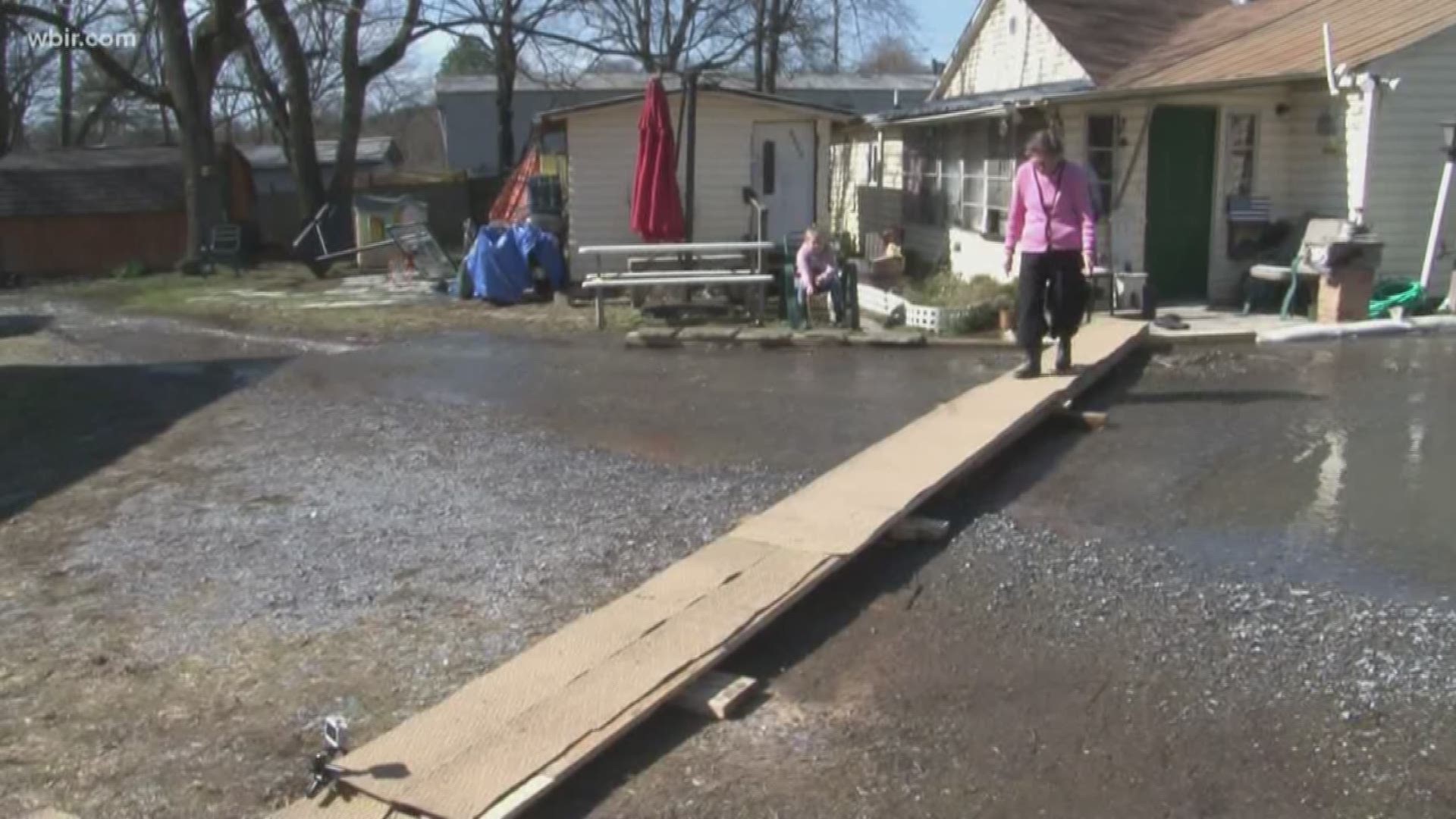 In Sevier County recent flooding is forcing a grandmother to walk a plank to get to her car.