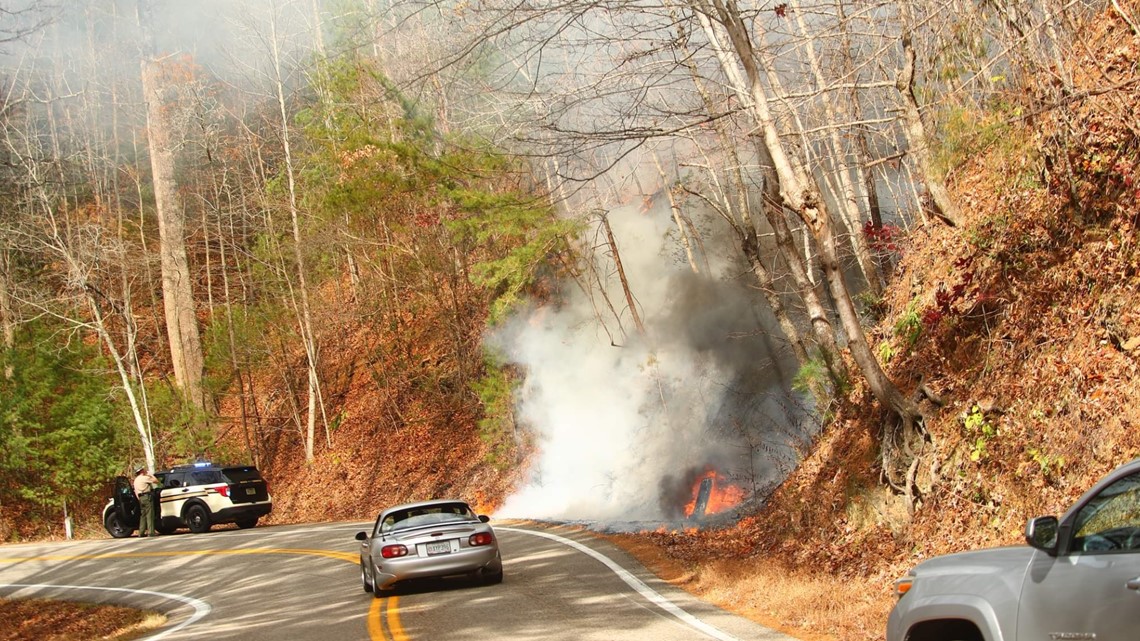 Crews contain wildfire on 'The Dragon' from motorcycle crash, lanes