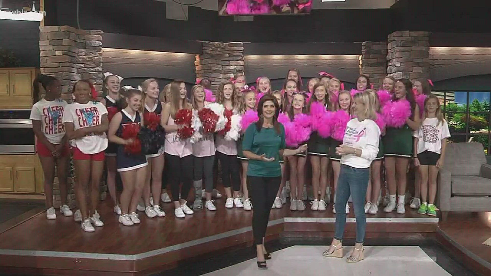 Amy Dunaway from Komen talks about upcoming race and local cheerleaders out on race route.