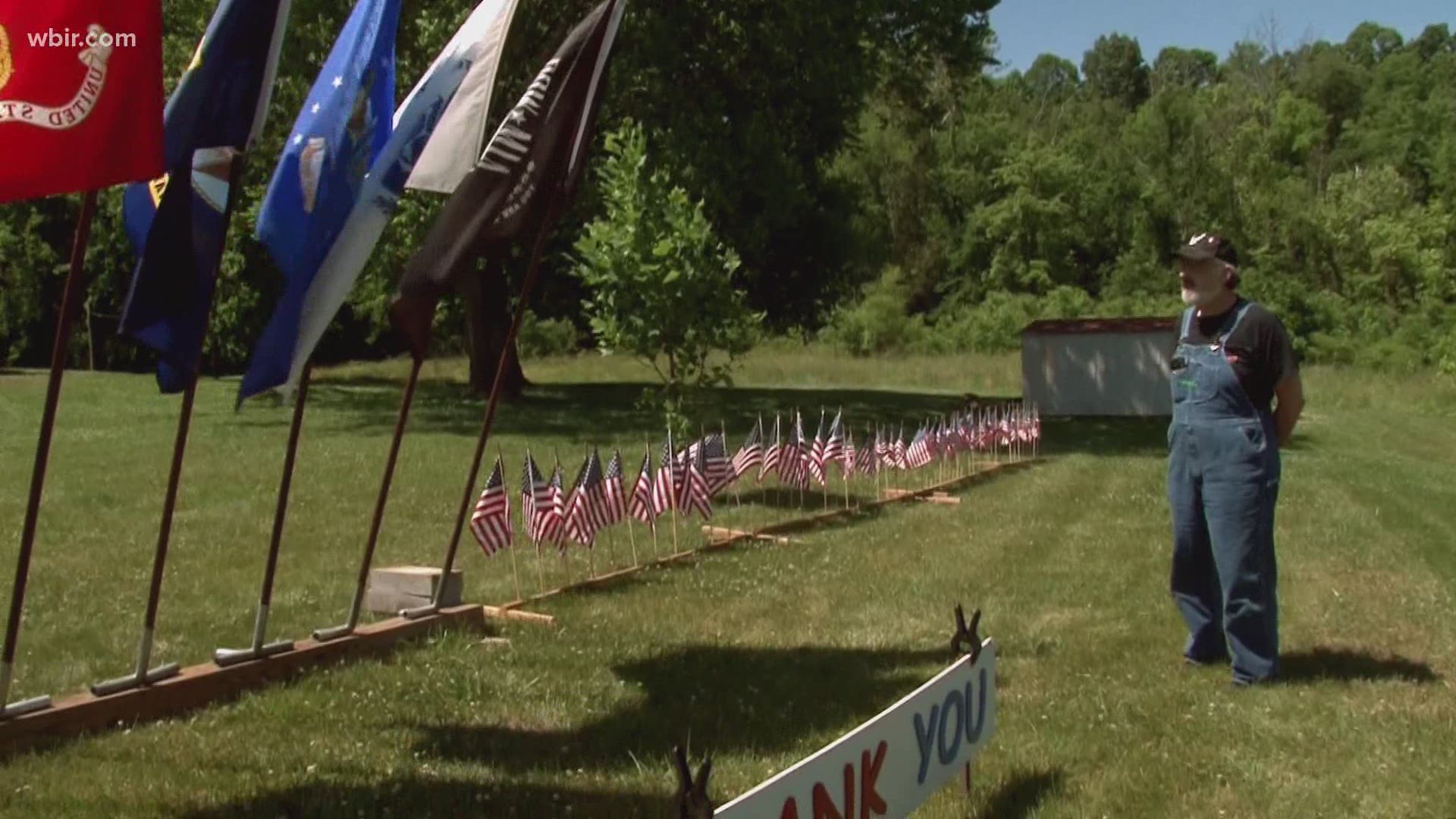 A family put dozens of flags outside their home as a tribute to those who've served.