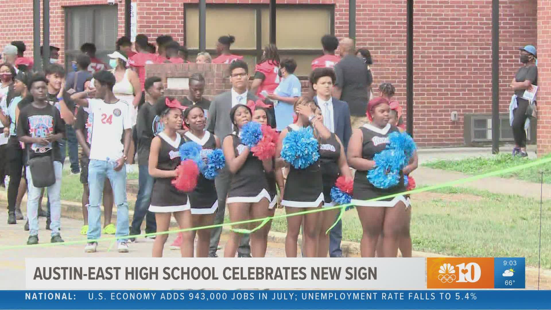 AustinEast High School community gathers for ceremonial lighting of