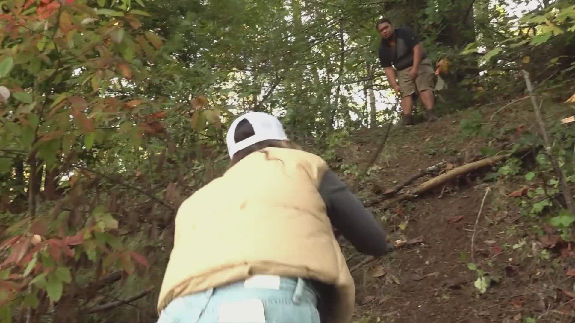 The only way Philip Buddha Morgan has been able to bring supplies to his home is up a steep embankment with a rope.