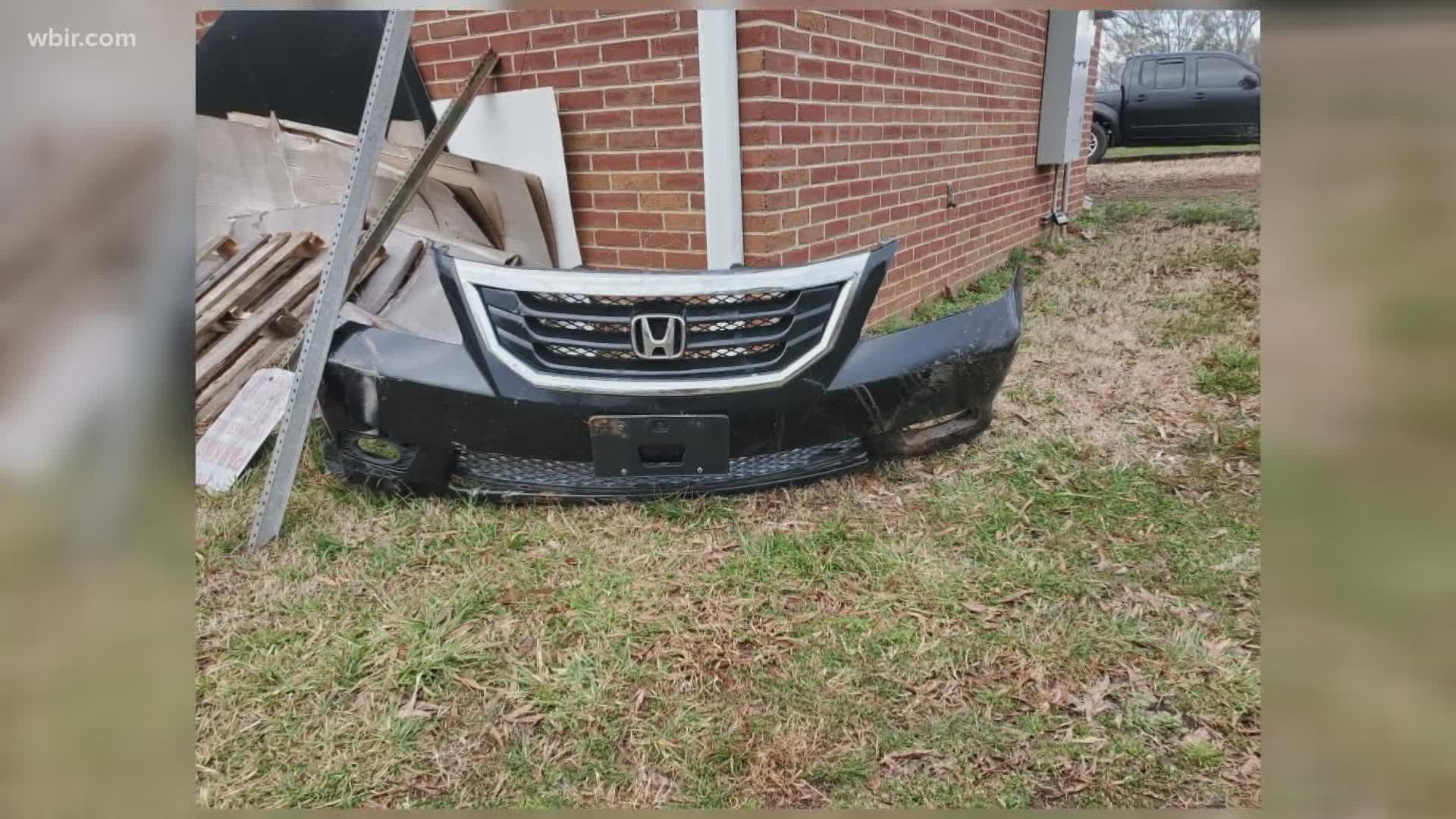 Officials said a car drove through the lawn at Lakeshore Park, hitting several light fixtures and leaving behind a car bumper.