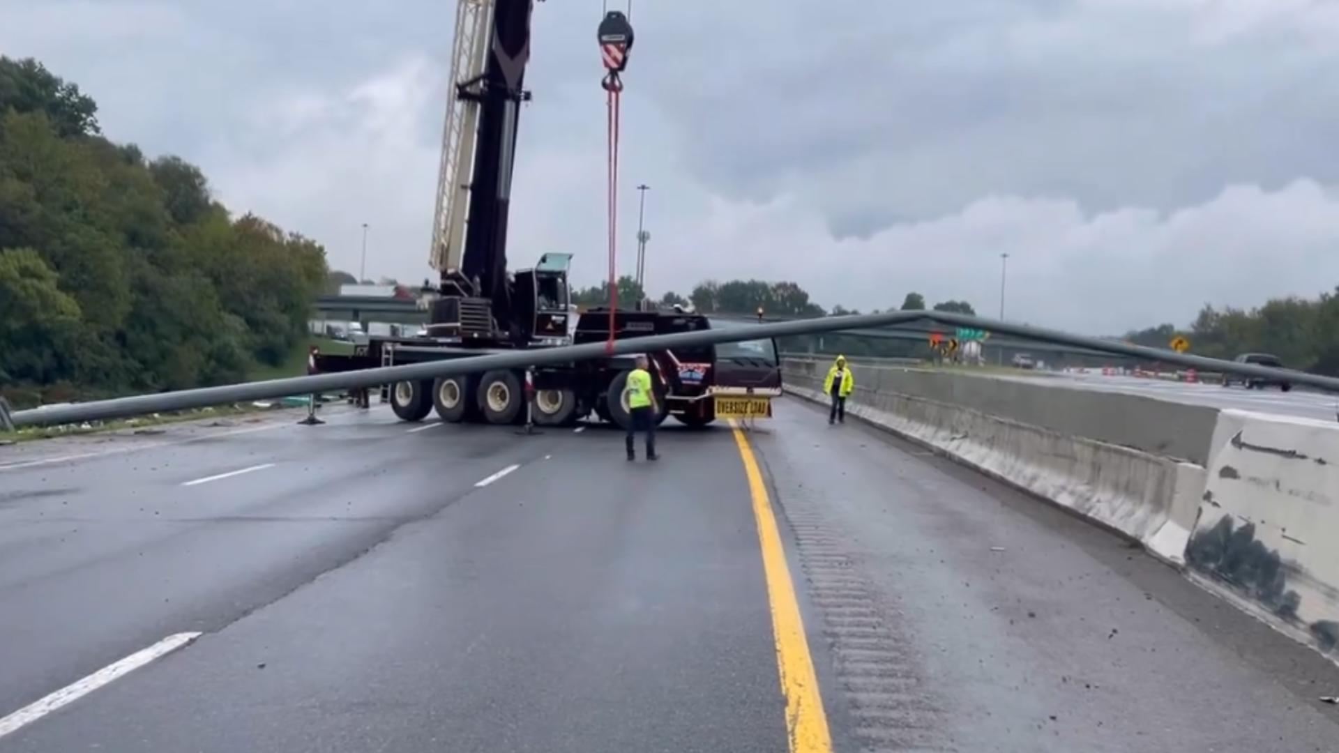 It was a coincidence that a crane truck got stuck in traffic after a semi-truck crashed and caused a large pole to fall across the interstate in Knoxville.