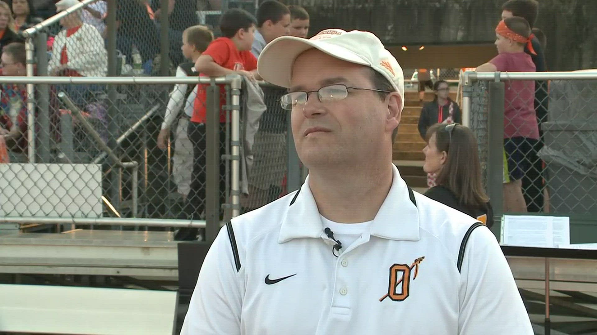 Richard May talks about his late father, Jim May, during the dedication of Oneida's football stadium.