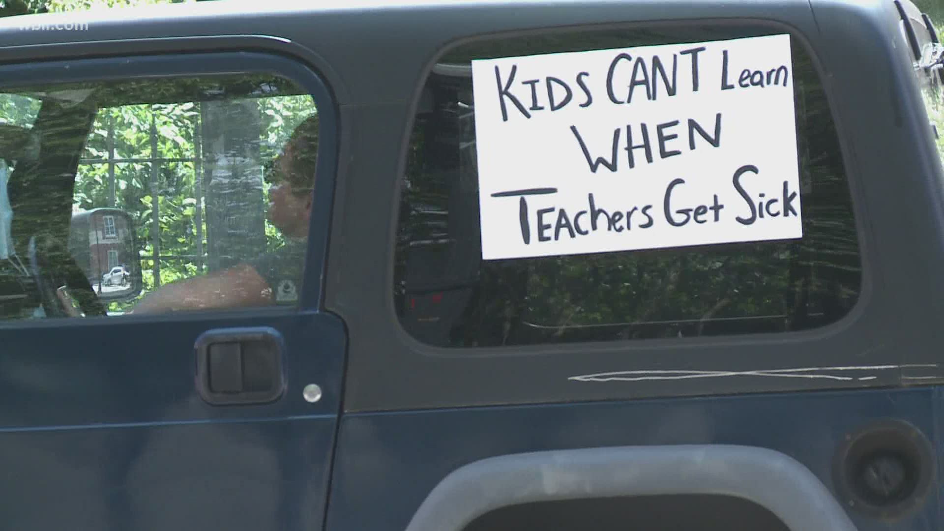 Knox County parents and teachers held a "Honk-A-Thon" protest in downtown Knoxville today.
They held signs from their car windows and honked - to protest going back