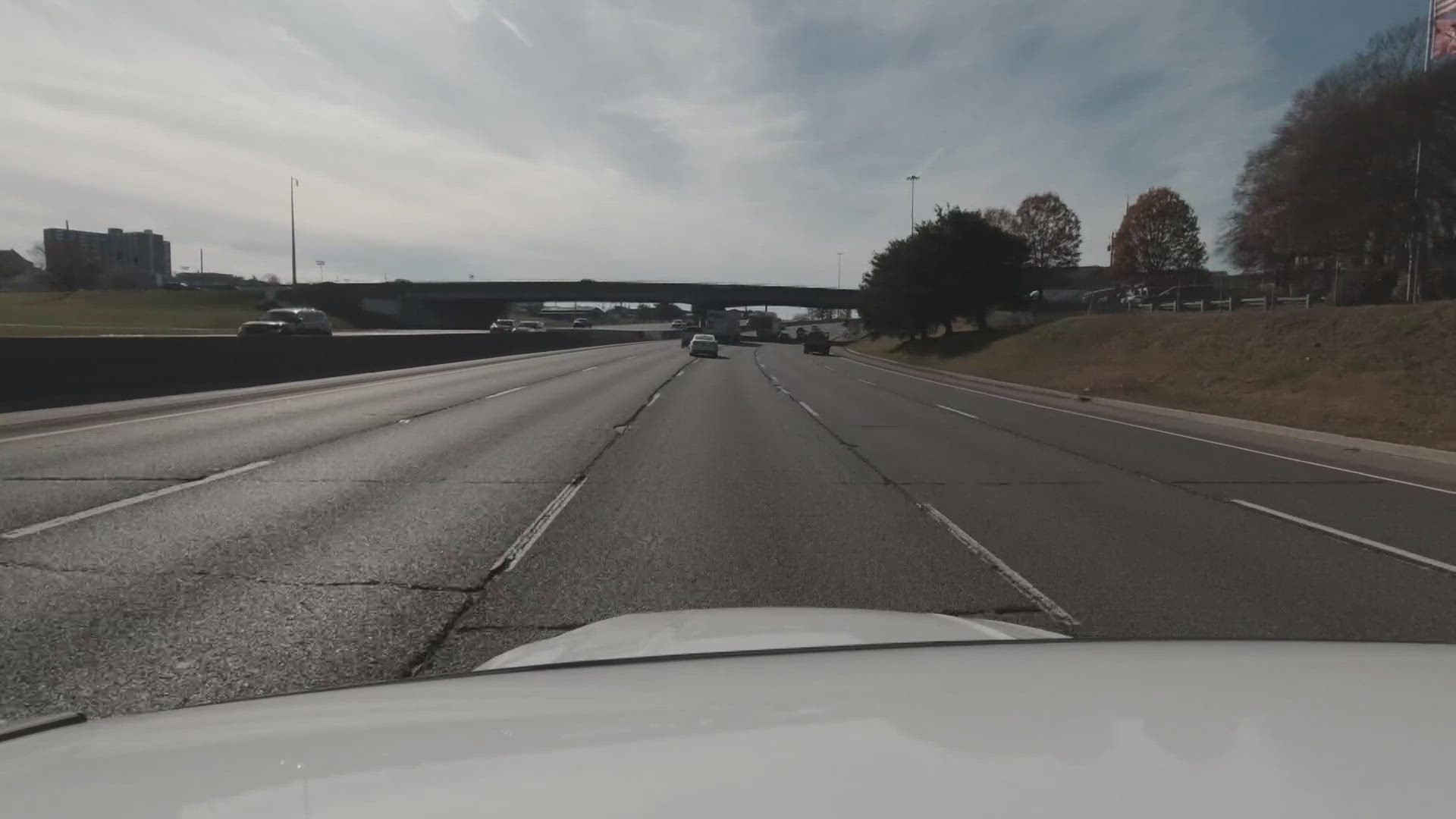 According to Knoxville Police, a Nissan SUV lost a tire when it crossed over the divider wall and struck another Nissan SUV going through the windshield.