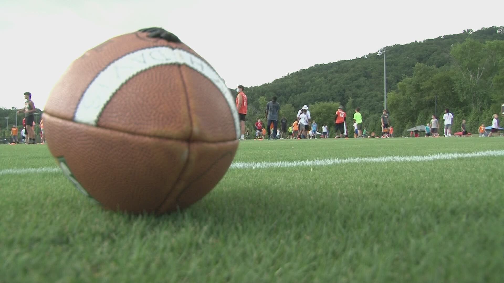 VFLs teach up and coming football players some of the basics of the sport at the Legends of Tennessee Football Camp.