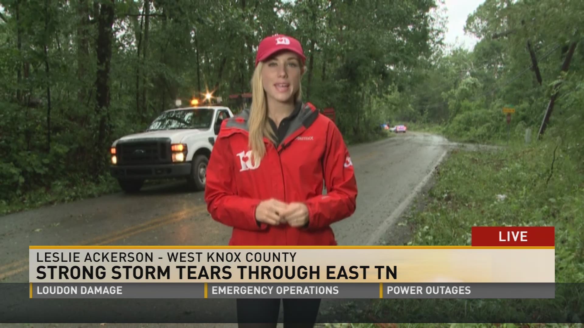 Leslie Ackerson looks at storm damage on Choto Rd. were some people were trapped in their cars overnight.