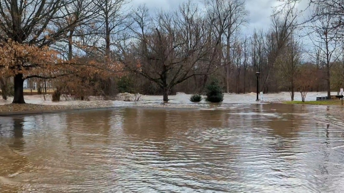 Little Pigeon River swells in Pigeon behind Christmas Place