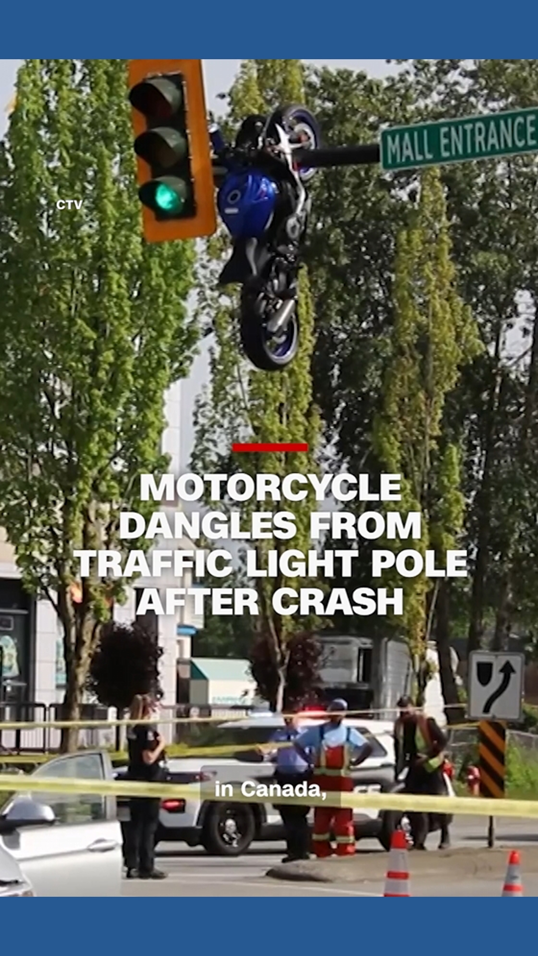 A motorcycle was left hanging from a traffic light pole after an ...
