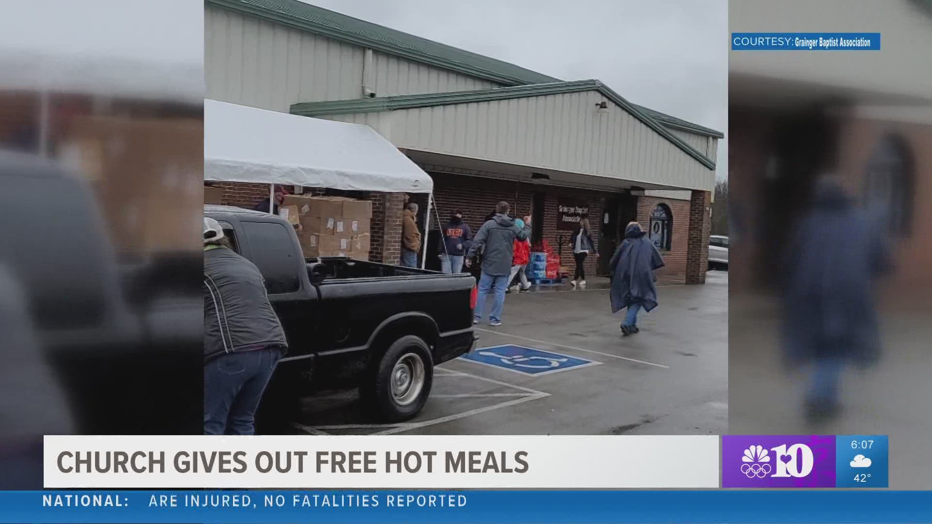 Families came by in their cars to pick up their Valentine's Day dinners, which included dishes like chicken casserole, corn and green beans.