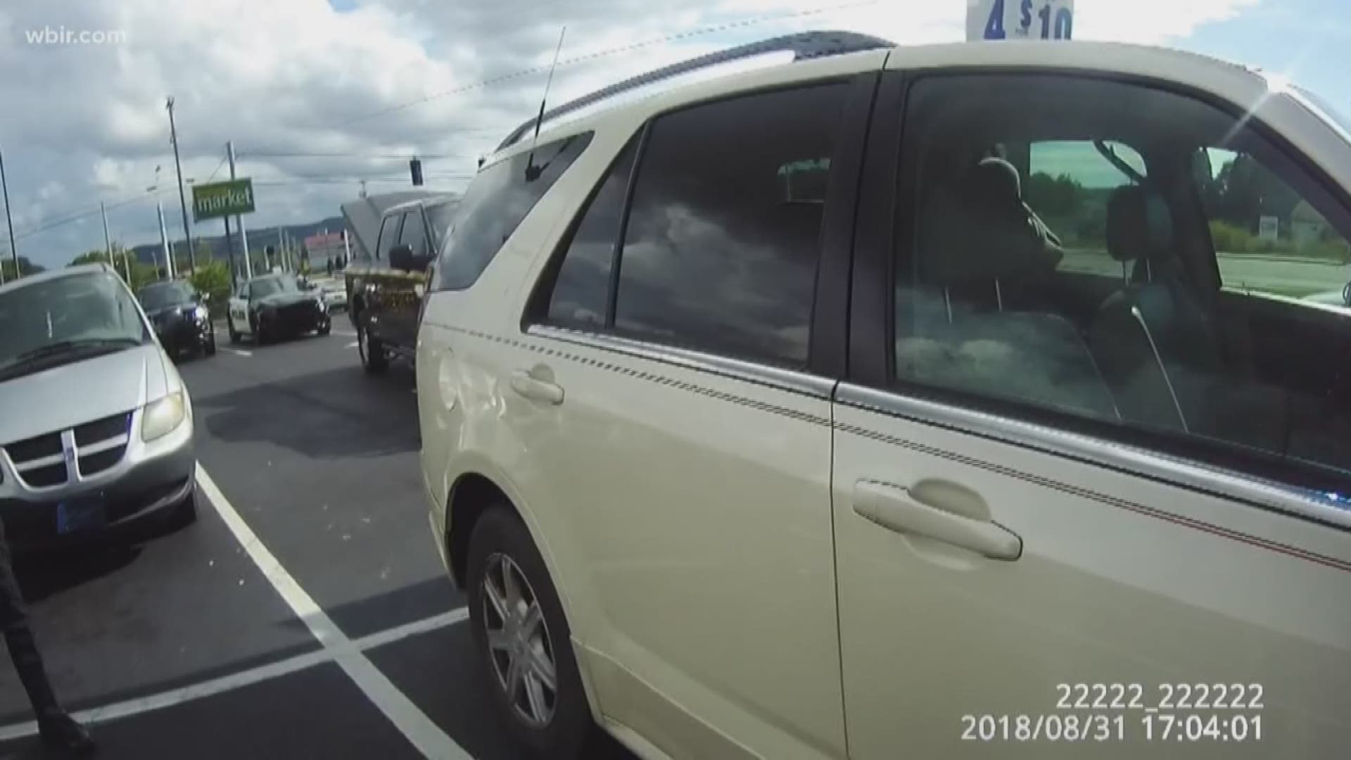 Watch: Police sergeant busts window to rescue teen trapped in hot car ...