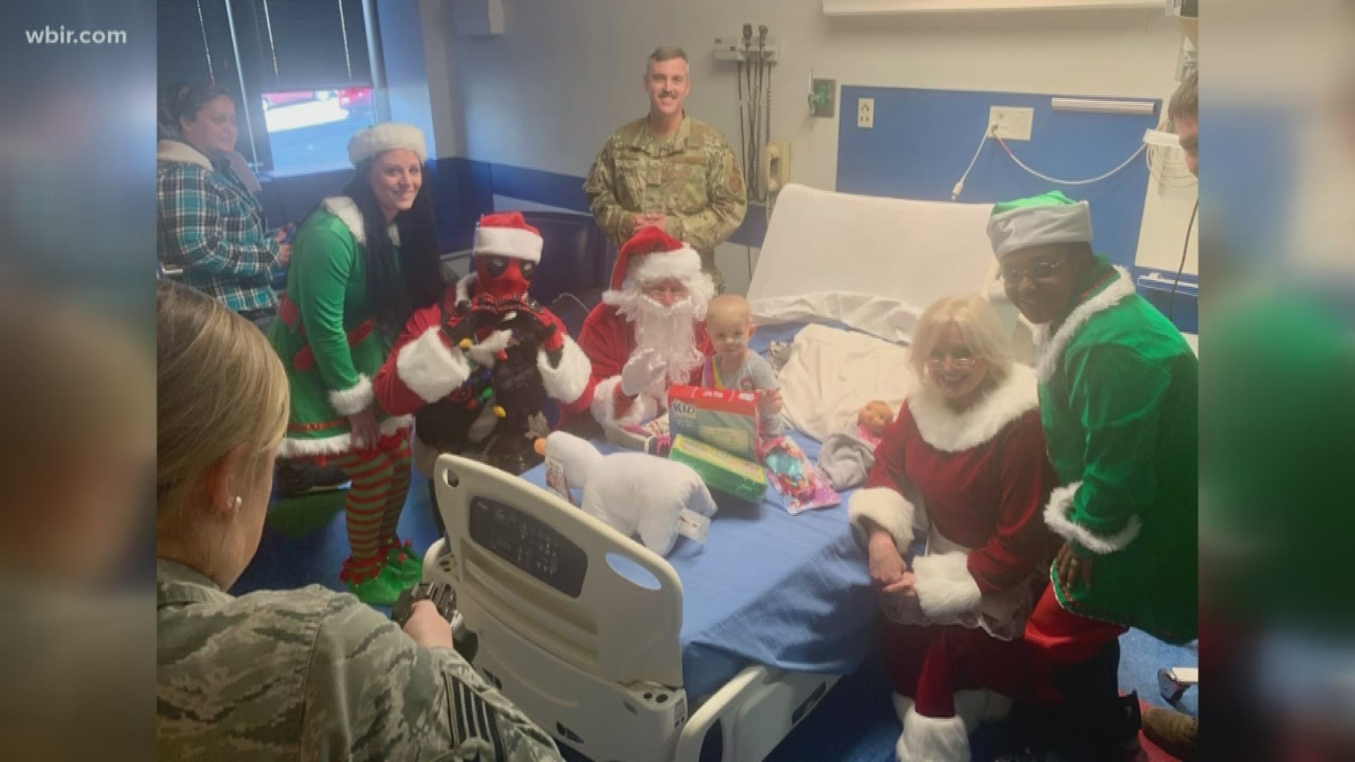 Santa -- and some surprising friends -- visited the hospital as part of a local Air Force squadron's "Santa Cops" program.