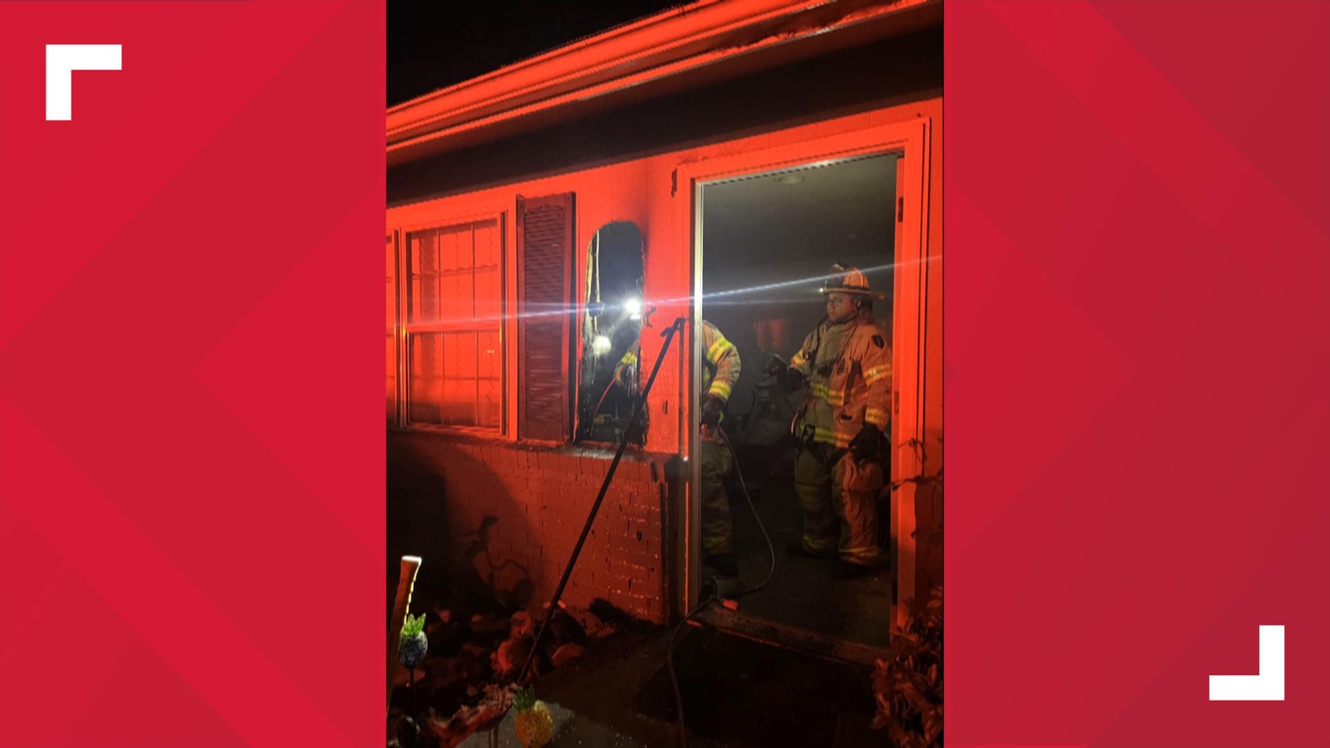 Neighbor works to put out house fire | wbir.com