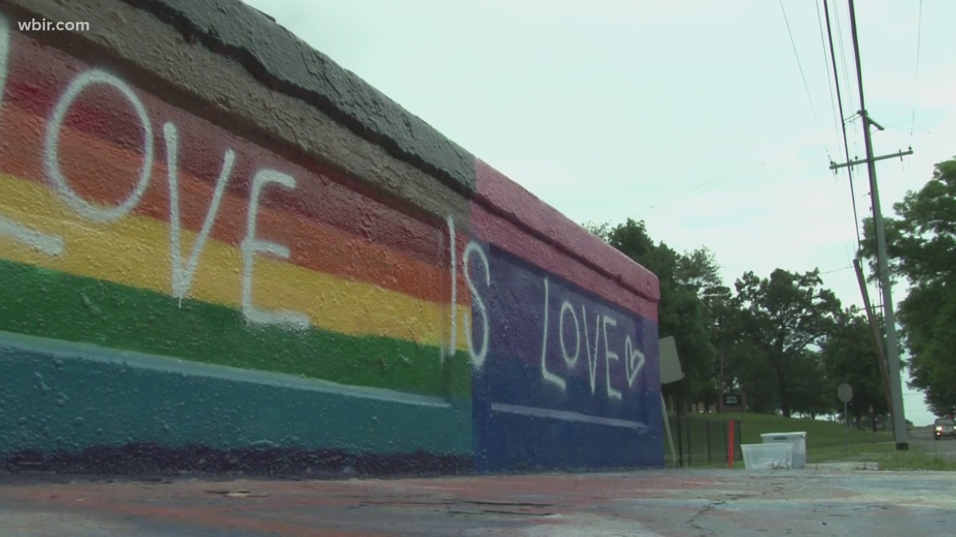 Police said hateful slurs were left on a bridge known for community art after two teens painted Pride flags on it. City crews cleared the slurs Friday morning.