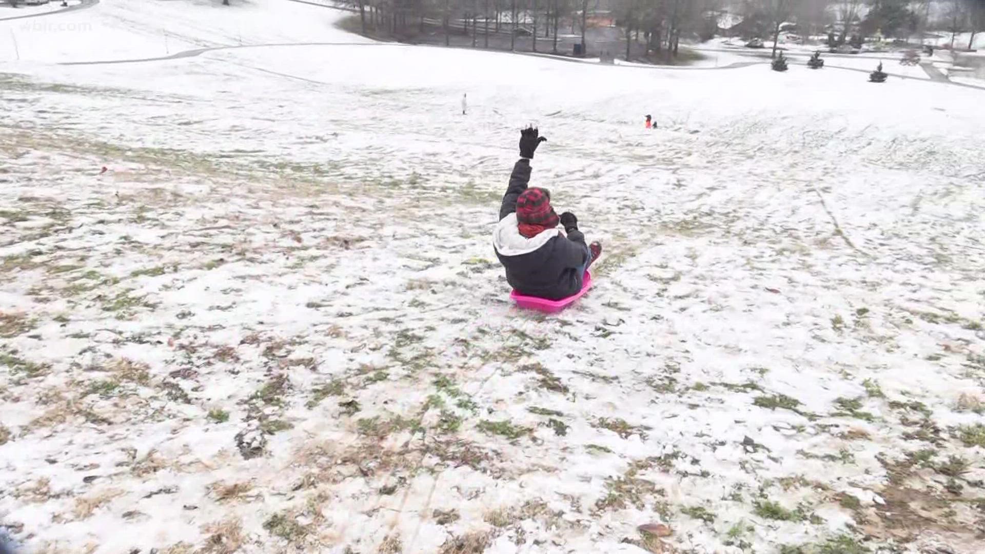 Shannon Smith sleds down west Knoxville hill in Lakeshore Park.