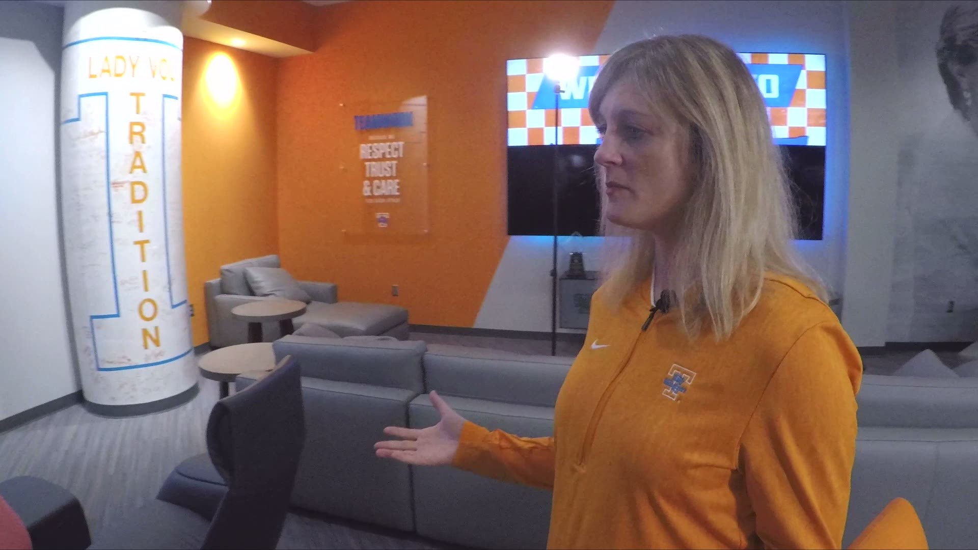 Coach Kellie Harper gives Beth Haynes a tour of the revamped locker room.