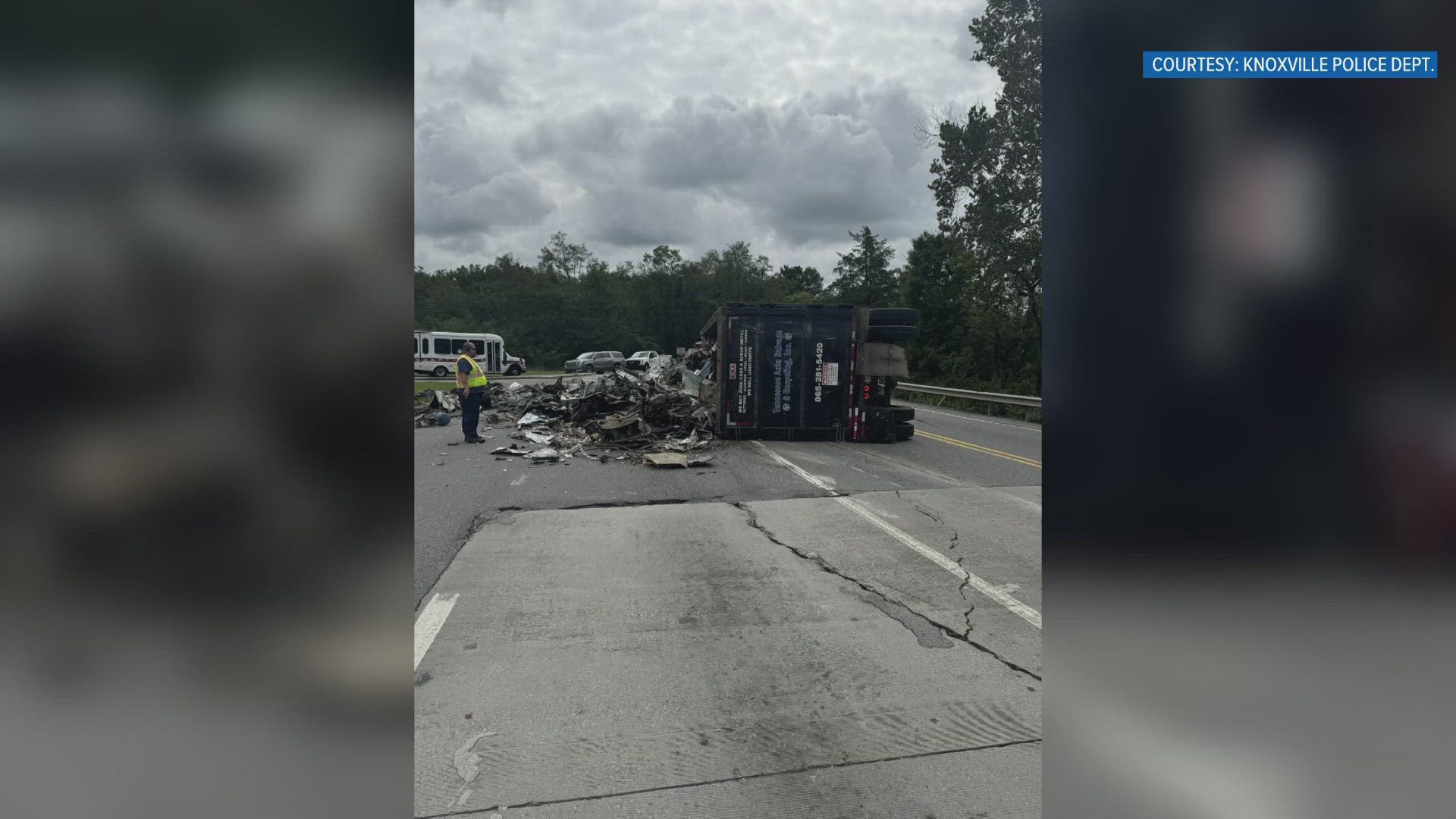 The truck was carrying a load of scrap and tipped over.