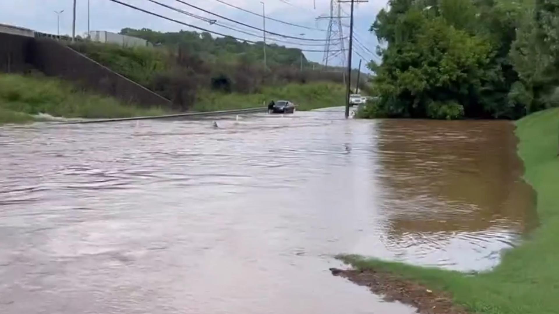 Papermill Drive looked like a lake near the Weisgarber Road intersection on Tuesday after heavy rains caused flash flooding in Knoxville. (Video: Jennifer)