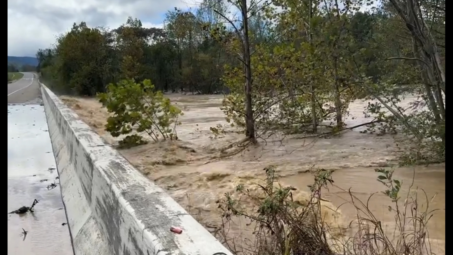 A portion of I-40 at the NC/TN state line was destroyed by a mudslide as river flooding raged alongside the interstate.