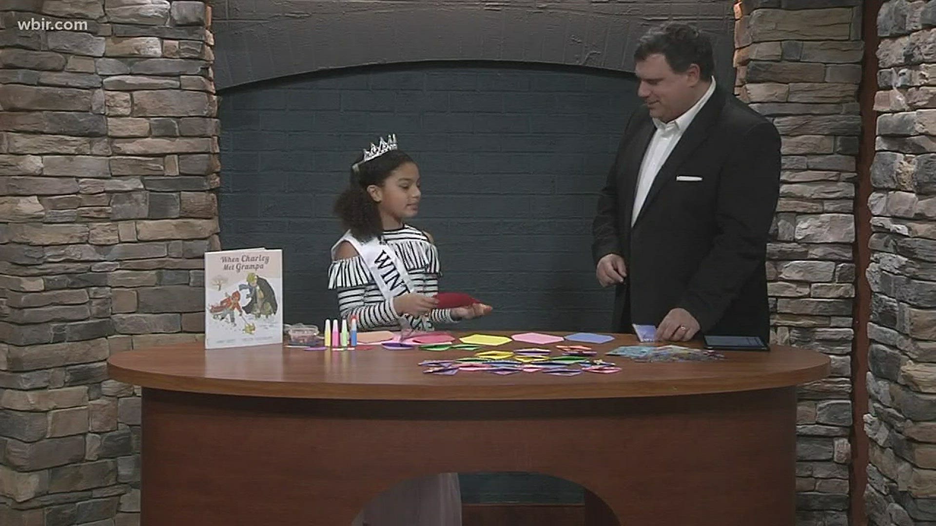 Junior anchor Nevaeh Frazier shows Russell a cute craft to do to make bookmarks.January 23, 2018-4pm