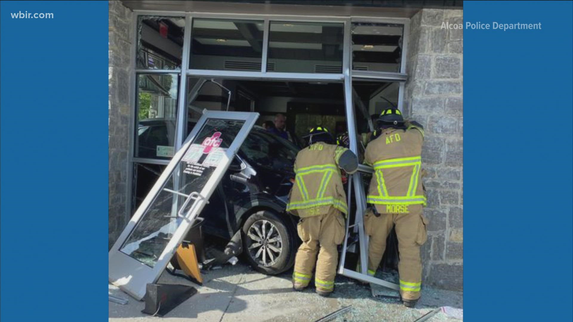 Police said a patient's arm was pinned after the vehicle came crashing into the urgent care center.