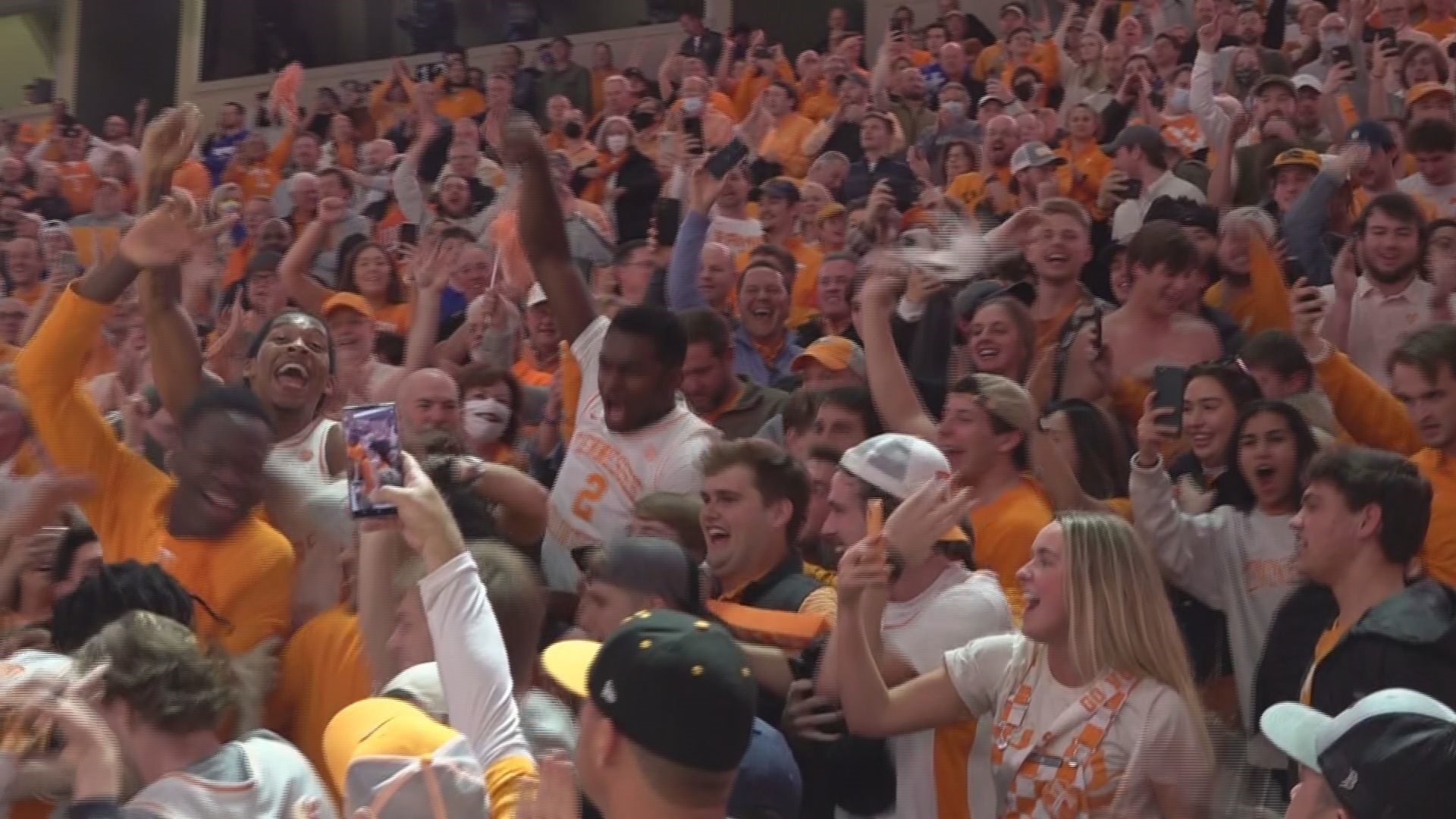 Some of the UT men's basketball players celebrated their win over the Wildcats in the student section.