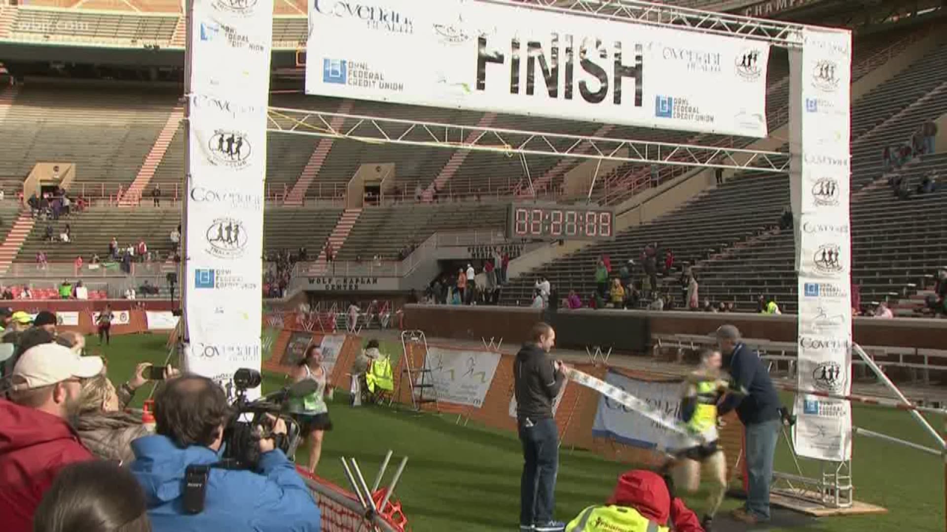The winner of the Covenant Health Knoxville Marathon crosses the finish line.