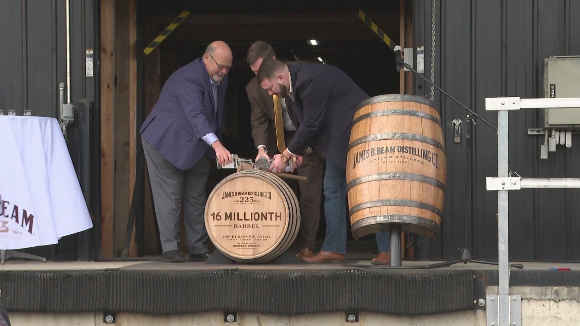 Andy Beshear and officials with Jim Beam celebrate the bourbon giant's birthday with the pouring of the 16-millionth barrel.