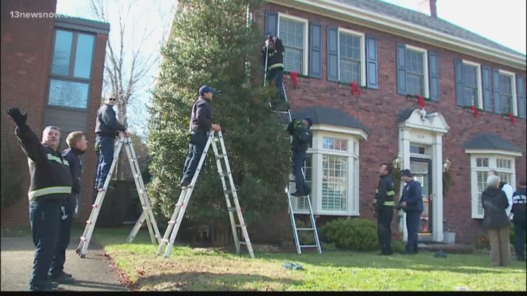 Norfolk firefighters finish hanging Christmas decorations